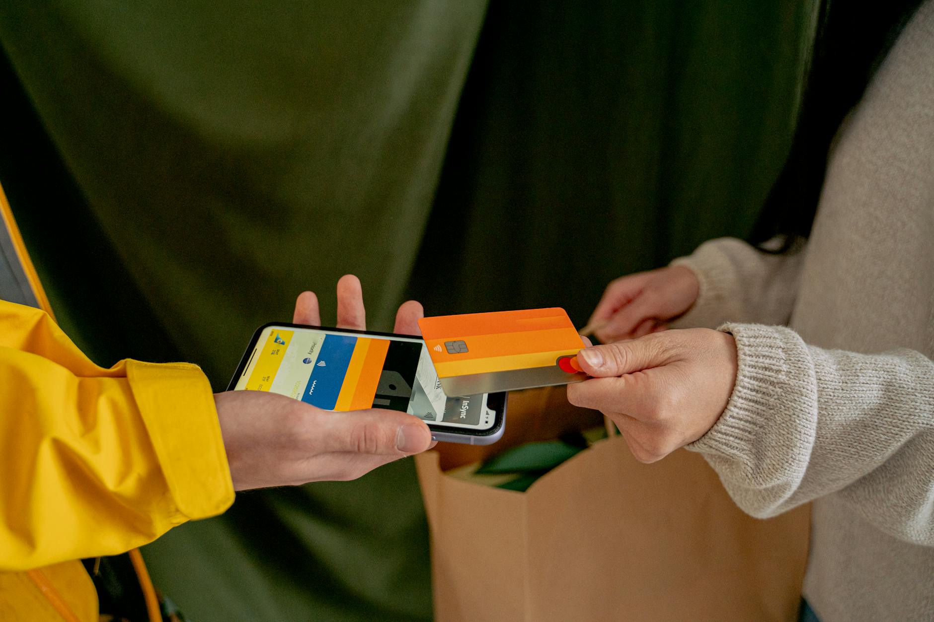 a woman paying with a credit card